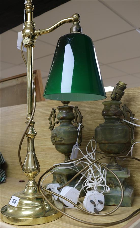 A brass students lamp and two onyx lamps